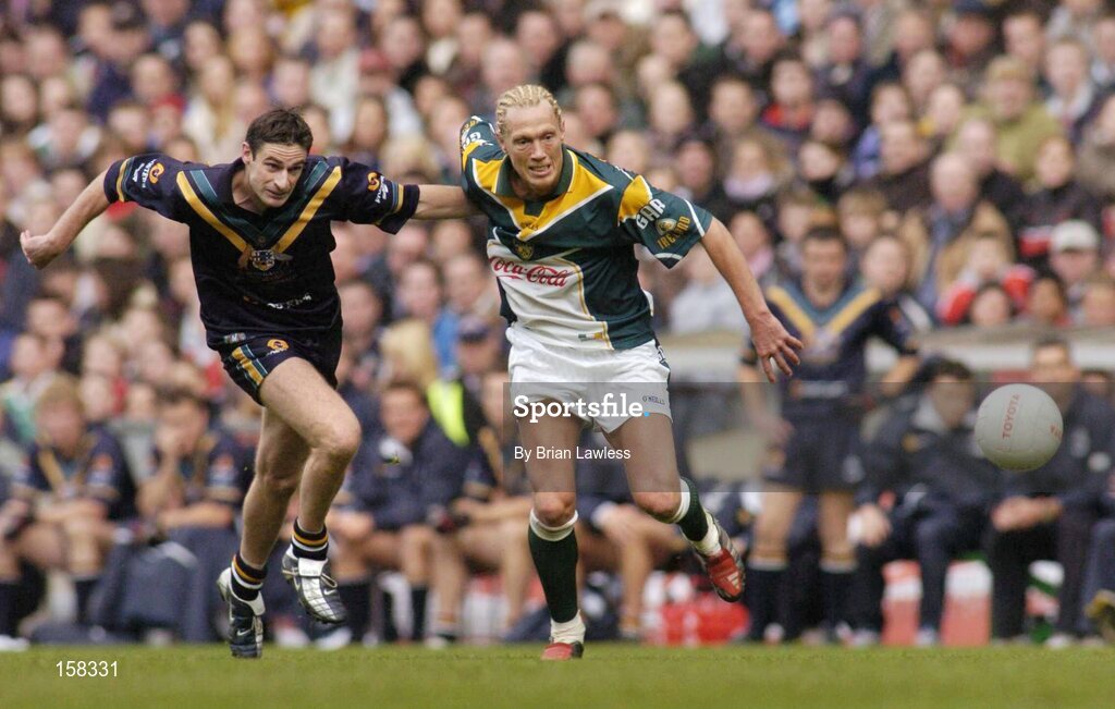 17 October 2004; Ciaran McDonald, Ireland, in action against Brady Rawlings, Australia. Coca Cola International Rules Series 2004, First Test, Ireland v Australia, Croke Park, Dublin. Picture credit; Brian Lawless / SPORTSFILE *** Local Caption *** Any photograph taken by SPORTSFILE during, or in connection with, the 2004 Coca Cola International Rules Series which displays GAA logos or contains an image or part of an image of any GAA intellectual property, or, which contains images of a GAA player/players in their playing uniforms, may only be used for editorial and non-advertising purposes.  Use of photographs for advertising, as posters or for purchase separately is strictly prohibited unless prior written approval has been obtained from the Gaelic Athletic Association.