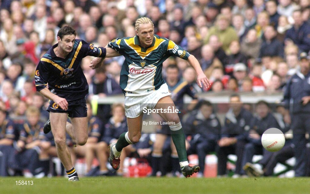 17 October 2004; Ciaran McDonald, Ireland, in action against Brady Rawlings, Australia. Coca Cola International Rules Series 2004, First Test, Ireland v Australia, Croke Park, Dublin. Picture credit; Brian Lawless / SPORTSFILE *** Local Caption *** Any photograph taken by SPORTSFILE during, or in connection with, the 2004 Coca Cola International Rules Series which displays GAA logos or contains an image or part of an image of any GAA intellectual property, or, which contains images of a GAA player/players in their playing uniforms, may only be used for editorial and non-advertising purposes.  Use of photographs for advertising, as posters or for purchase separately is strictly prohibited unless prior written approval has been obtained from the Gaelic Athletic Association.