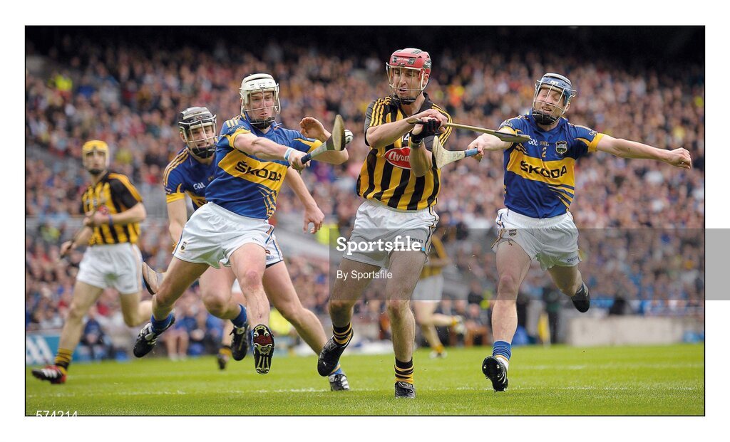 4 September 2011; No room to swing a Cat. Tipperary men come at Eoin Larkin from all angles but its Paddy Stapleton who times his block to perfection with Michael Cahill closing in from the opposite direction. Picture credit; Paul Mohan / SPORTSFILE