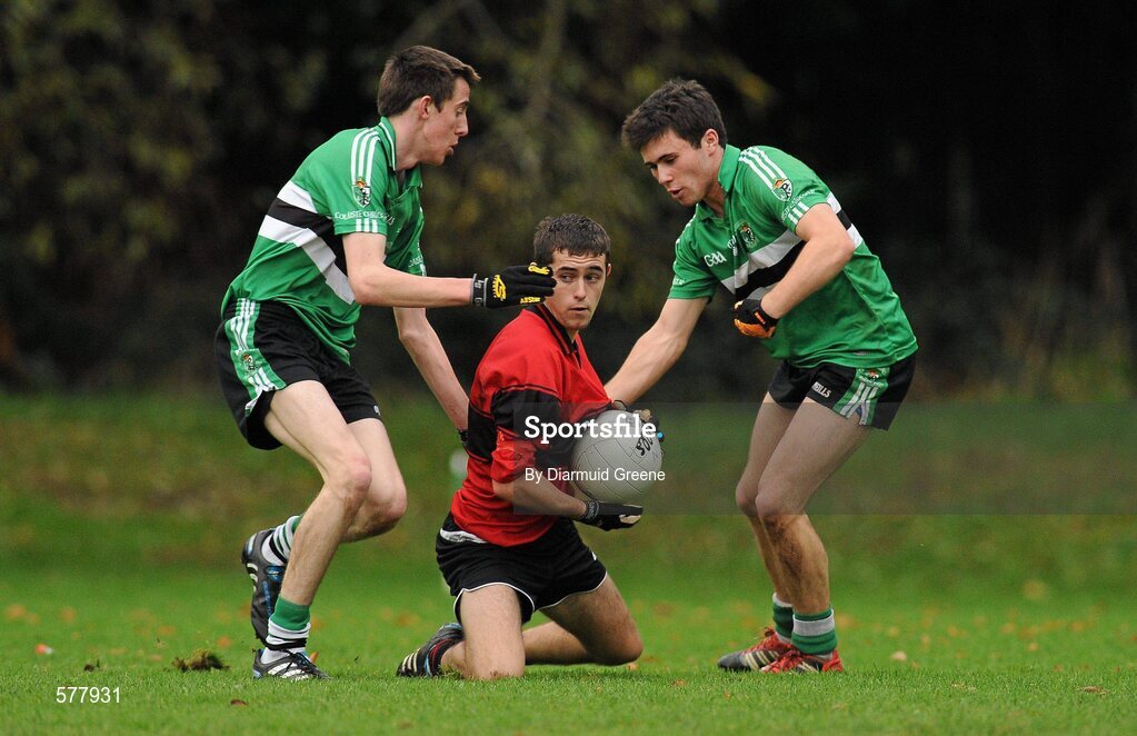 23 November 2011; Sam Oakes, Colaiste an Spioraid Naoimh, in action against Ian Lucey, left, and Stephen Cronin, Colaiste Chríost Rí. Corn Ui Mhuiri Senior 'A' Football Championship, Colaiste an Spioraid Naoimh v Colaiste Chríost Rí, Ballincollig GAA Club, Co. Cork. Picture credit: Diarmuid Greene / SPORTSFILE