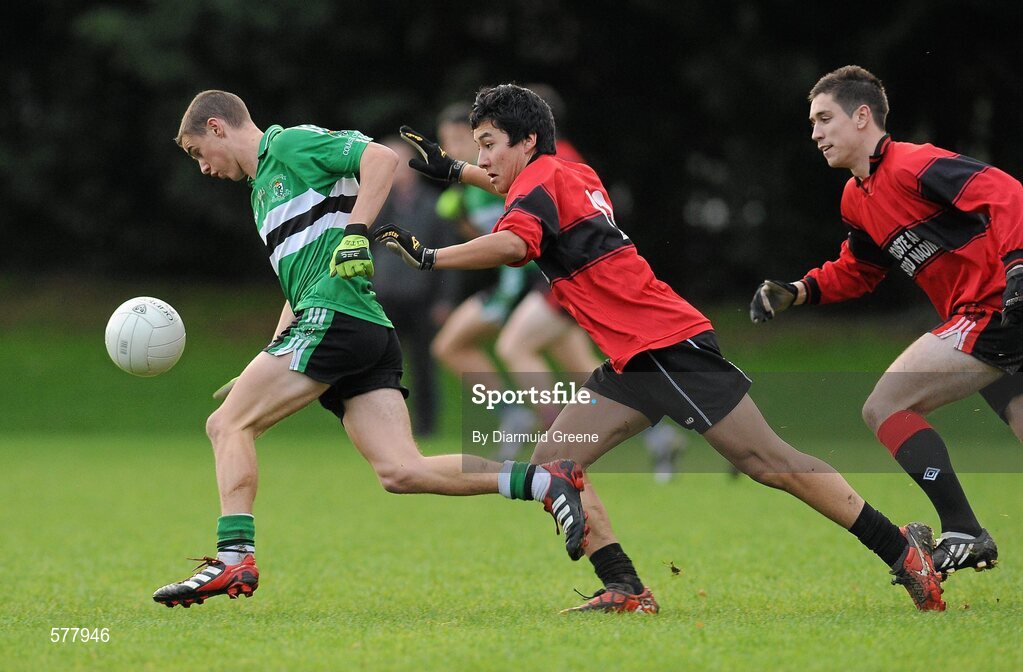 23 November 2011; Enda Dennehy, Colaiste Chríost Rí, gets away from Emmet Ryle, and Conor Dorman, Colaiste an Spioraid Naoimh. Corn Ui Mhuiri Senior 'A' Football Championship, Colaiste an Spioraid Naoimh v Colaiste Chríost Rí, Ballincollig GAA Club, Co. Cork. Picture credit: Diarmuid Greene / SPORTSFILE
