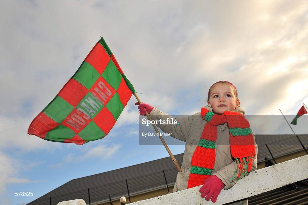 27 November 2011; Carnacon supporter Shauna McGing, age 4, and daughter of Carnacon player Michelle McGing, cheers on her team before the start of the game. Tesco All-Ireland Senior Ladies Football Club Championship Final, Carnacon v Na Fianna, Ballymahon, Co. Longford. Picture credit: David Maher / SPORTSFILE