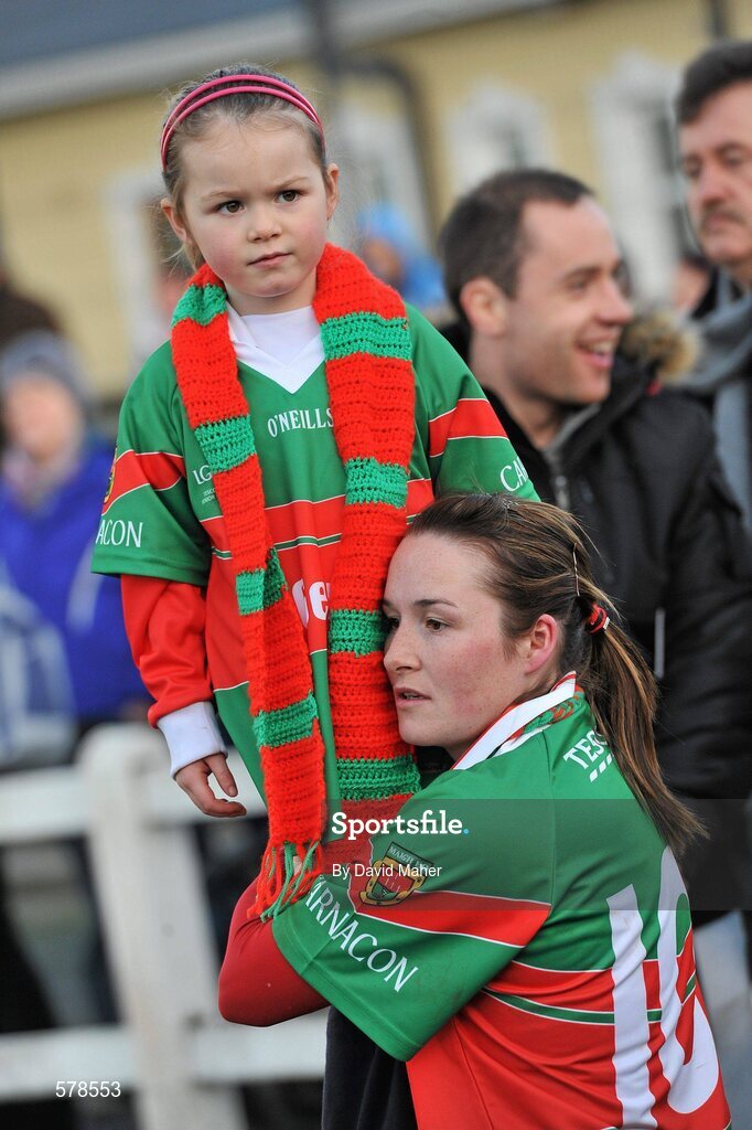 27 November 2011; Michelle McGing,  Carnacon, with her daughter Shauna, age 4, after winning the Tesco All-Ireland Senior Ladies Football Club Championship Final. Tesco All-Ireland Senior Ladies Football Club Championship Final, Carnacon v Na Fianna, Ballymahon, Co. Longford. Picture credit: David Maher / SPORTSFILE