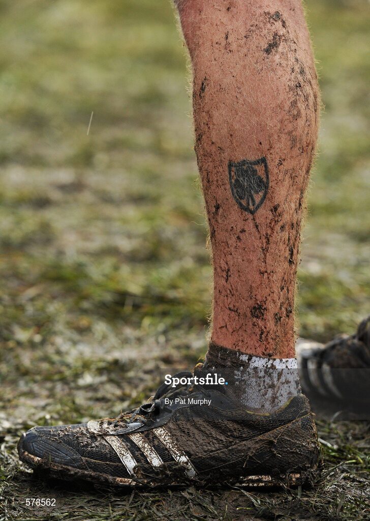 27 November 2011; An athletes footwear and tattoo are covered in mud after the senior men's race during the Woodie’s DIY Inter County Cross Country Championships. Sligo Racecourse, Sligo. Picture credit: Pat Murphy / SPORTSFILE