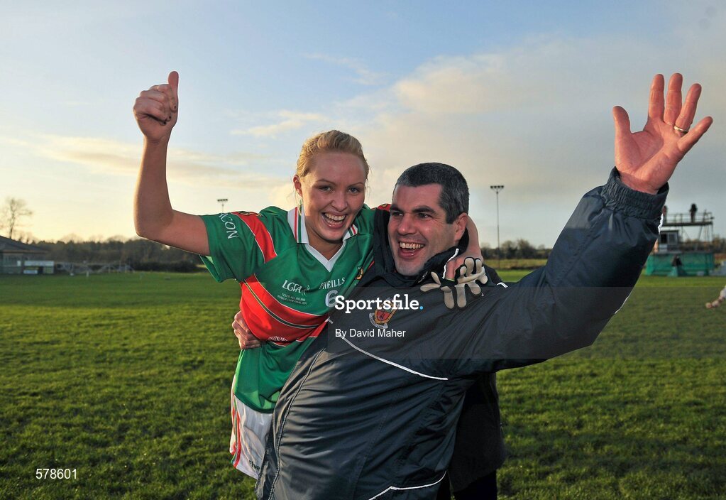 27 November 2011; Aoife Loftus, Carnacon, celebrates with a supporter after winning the Tesco All-Ireland Senior Ladies Football Club Championship Final. Tesco All-Ireland Senior Ladies Football Club Championship Final, Carnacon v Na Fianna, Ballymahon, Co. Longford. Picture credit: David Maher / SPORTSFILE