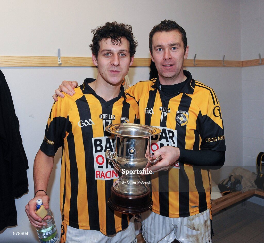 27 November 2011; Jamie Clarke, left, and Oisin McConville, Crossmaglen Rangers, celebrate with the Seamus McFerran cup in the dressing room after the game. AIB Ulster GAA Football Senior Club Championship Final, Crossmaglen Rangers, Armagh v Burren St Mary's, Down, Morgan Athletic Grounds, Armagh. Picture credit: Oliver McVeigh / SPORTSFILE