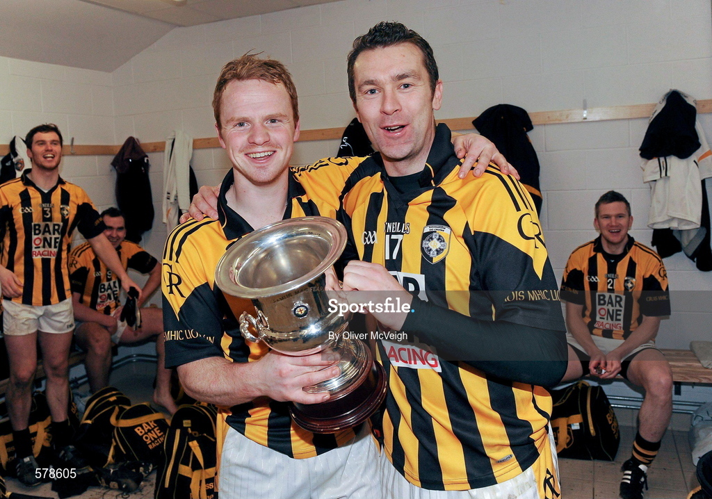 27 November 2011; The Crossmaglen Rangers goalscorers Paul McKeown, left, and Oisin McConville celebrate with the Seamus McFerran cup in the dressing room after the game. AIB Ulster GAA Football Senior Club Championship Final, Crossmaglen Rangers, Armagh v Burren St Mary's, Down, Morgan Athletic Grounds, Armagh. Picture credit: Oliver McVeigh / SPORTSFILE