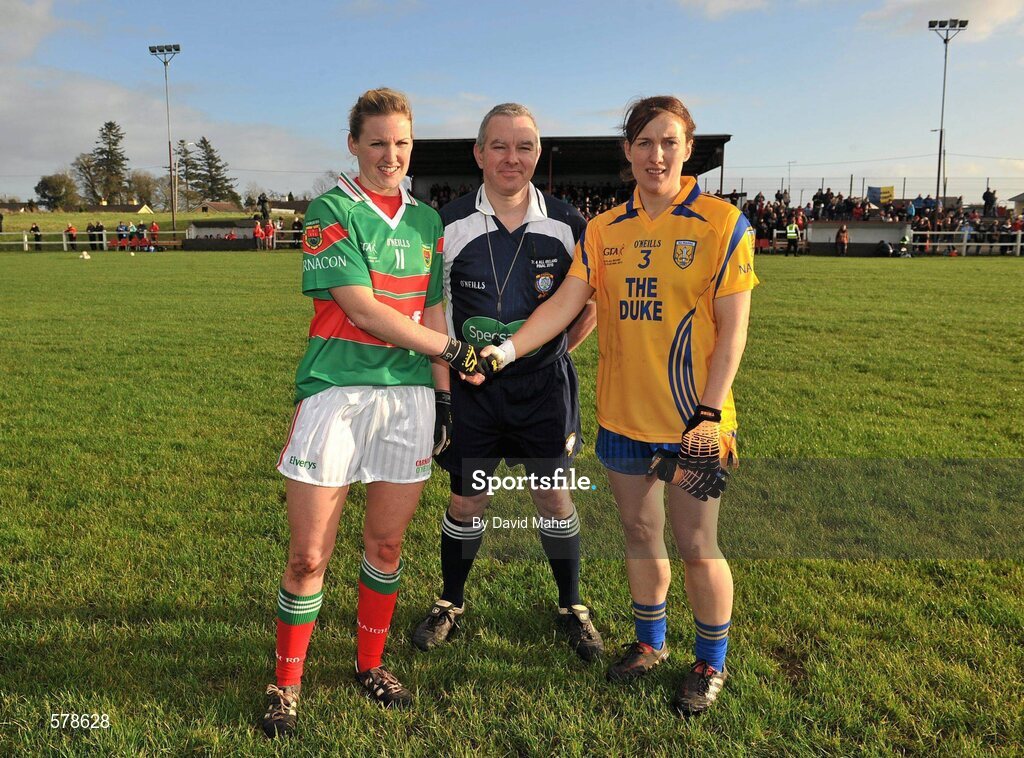 27 November 2011; Referee Michael O'Keeffe, with captians Fiona McHale, Carnacon, left, and Lorraine O'Sullivan, Na Fianna. Tesco All-Ireland Senior Ladies Football Club Championship Final, Carnacon v Na Fianna, Ballymahon, Co. Longford. Picture credit: David Maher / SPORTSFILE