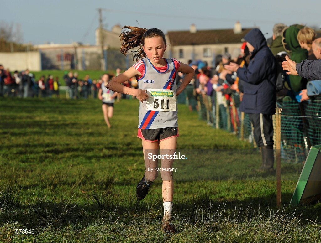 27 November 2011; Jodie McCann, Dundrum South Dublin AC, crosses the finish line to win the Girl's U12 race at the Woodie’s DIY Inter County Cross Country Championships. Sligo Racecourse, Sligo. Picture credit: Pat Murphy / SPORTSFILE