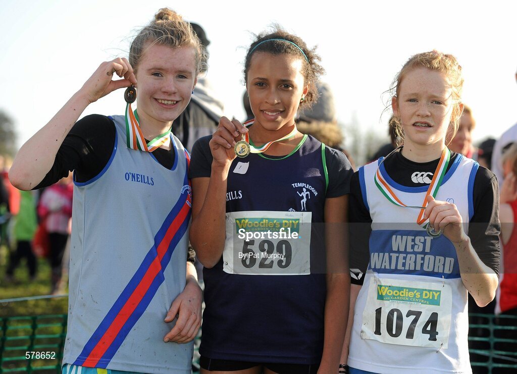 27 November 2011; Nadia Power, Templeogue AC, Dublin, who won the Girl's U14 race at the Woodie’s DIY Inter County Cross Country Championships with second placed Aoife Hamilton, West Waterford AC, right, and third placed Rachael Dunne, Dundrum South Dublin AC, left. Sligo Racecourse, Sligo. Picture credit: Pat Murphy / SPORTSFILE