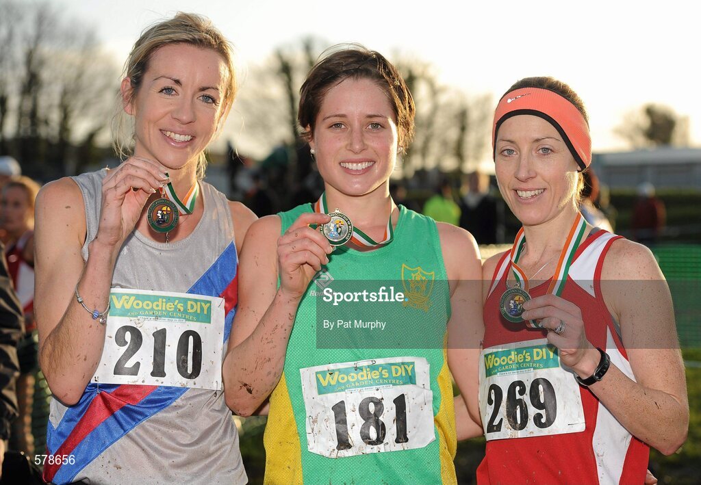 27 November 2011; Sara Louise Treacy, Meath, winner of the senior women's race at the Woodie’s DIY Inter County Cross Country Championships, with second placed, Claire McCarthy, Cork, right, and third placed Catherine Devitt, Dundrum South Dublin AC, left. Sligo Racecourse, Sligo. Picture credit: Pat Murphy / SPORTSFILE
