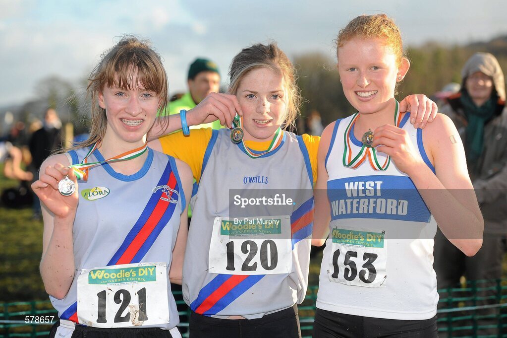 27 November 2011; Siofra Cleirigh Buttner, Dundrum South Dublin AC, winner of the Junior Women's race at the Woodie’s DIY Inter County Cross Country Championships, with second placed, Claire McCarthy, Dundrum South Dublin AC, left, and third placed Kate Veale, West Waterford AC, right. Sligo Racecourse, Sligo. Picture credit: Pat Murphy / SPORTSFILE