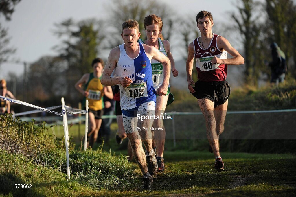 27 November 2011; Eventual winner Jake Byrne, Mullingar Harriers AC, Co. Westmeath, 60, races alongside second placed finisher Kevin Dooney, Raheney Shamrocks AC, Dublin, partially hidden, and Liam Brady, Tullamore Harriers, Co Offaly, 102, during the Junior Men's race at the Woodie’s DIY Inter County Cross Country Championships. Sligo Racecourse, Sligo. Picture credit: Pat Murphy / SPORTSFILE