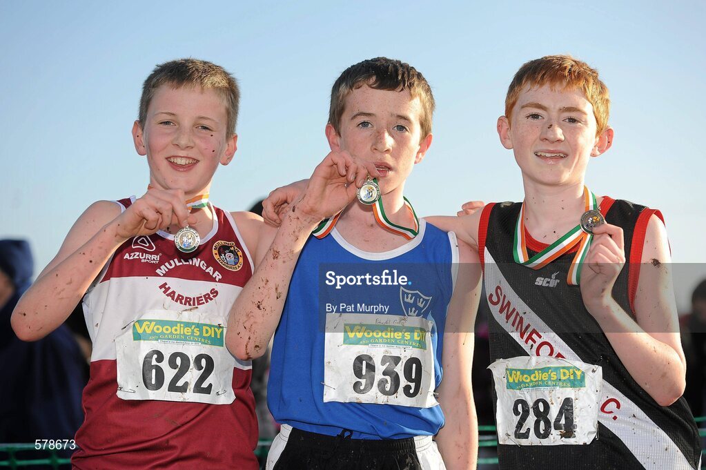 27 November 2011; Fearghal Curtin, Cork, winner of the Boy's U14 race at the Woodie’s DIY Inter County Cross Country Championships with second placed Cormac Dalton, Mullingar Harriers AC, Co. Westmeath, left, and third placed, Shane Bracken, Swinford AC, Co. Mayo, right. Sligo Racecourse, Sligo. Picture credit: Pat Murphy / SPORTSFILE