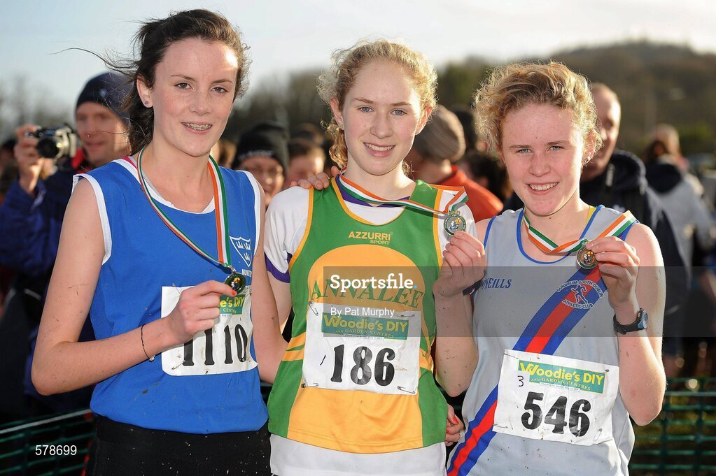27 November 2011; Clodagh O'Reilly, Annalee AC, winner of the Girl's U16 race at the Woodie’s DIY Inter County Cross Country Championships with second placed Aisling Quinn, Waterford, left, and third placed Sarah Fitzpatrick, Dundrum South Dublin AC, right. Sligo Racecourse, Sligo. Picture credit: Pat Murphy / SPORTSFILE