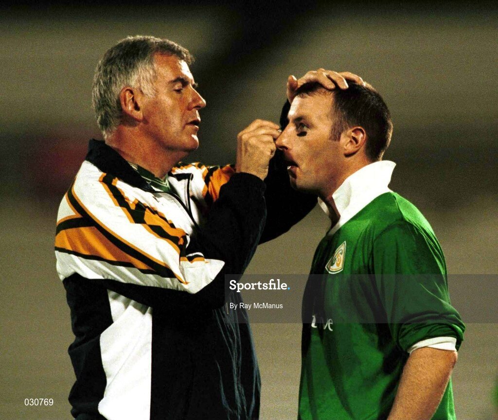 12 October 1999;  Dr. Jack Finn applies theatrical makeup to Declan O'Keeffe's cheek bones in an effort to cut down the glare from the floodlights at the training session in Football Park, Adelaide in preperation for Friday's second test against Australia. Football Park, Adelaide, Australia. Picture credit; Ray McManus / SPORTSFILE