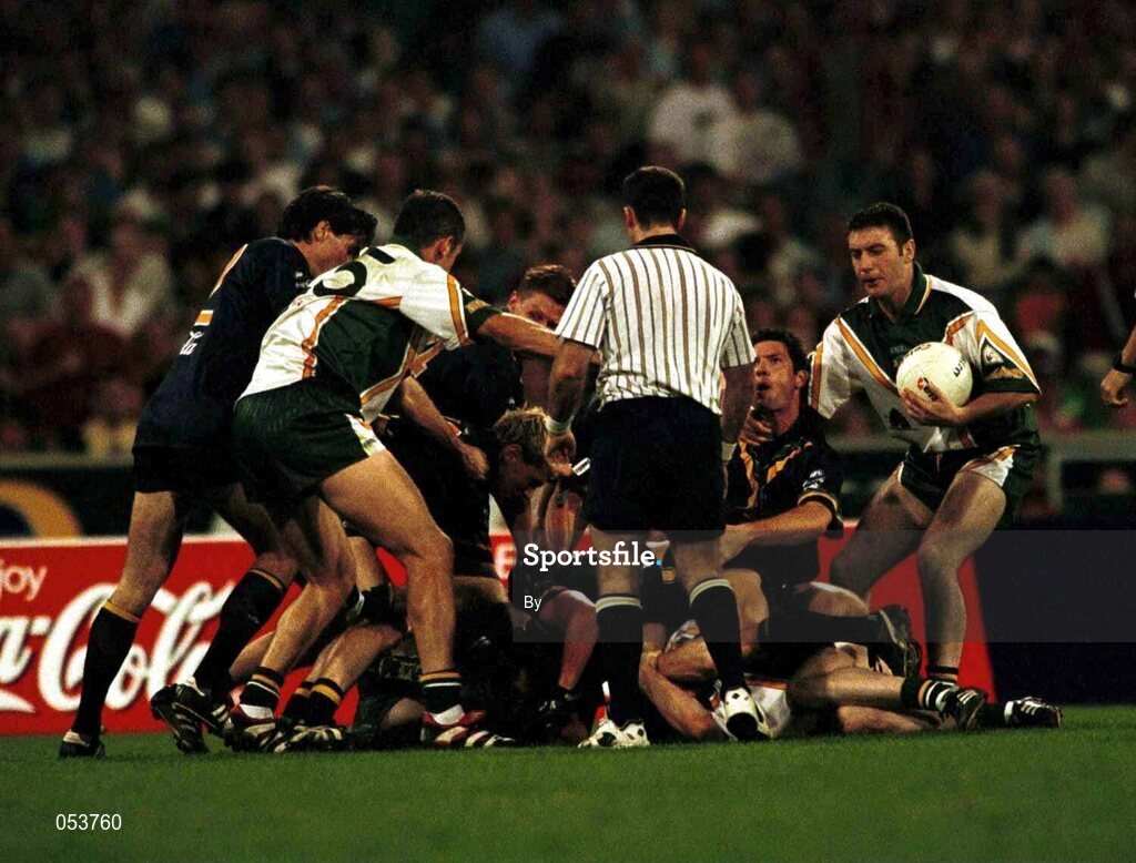 8 October 1999; Australian Referee Andrew Coates moves in to settle "a minor difference of opinion" during the first Test at the Melbourne Cricket Grounds, Melbourne, Australia. International Rules. Picture credit, Ray McManus/SPORTSFILE