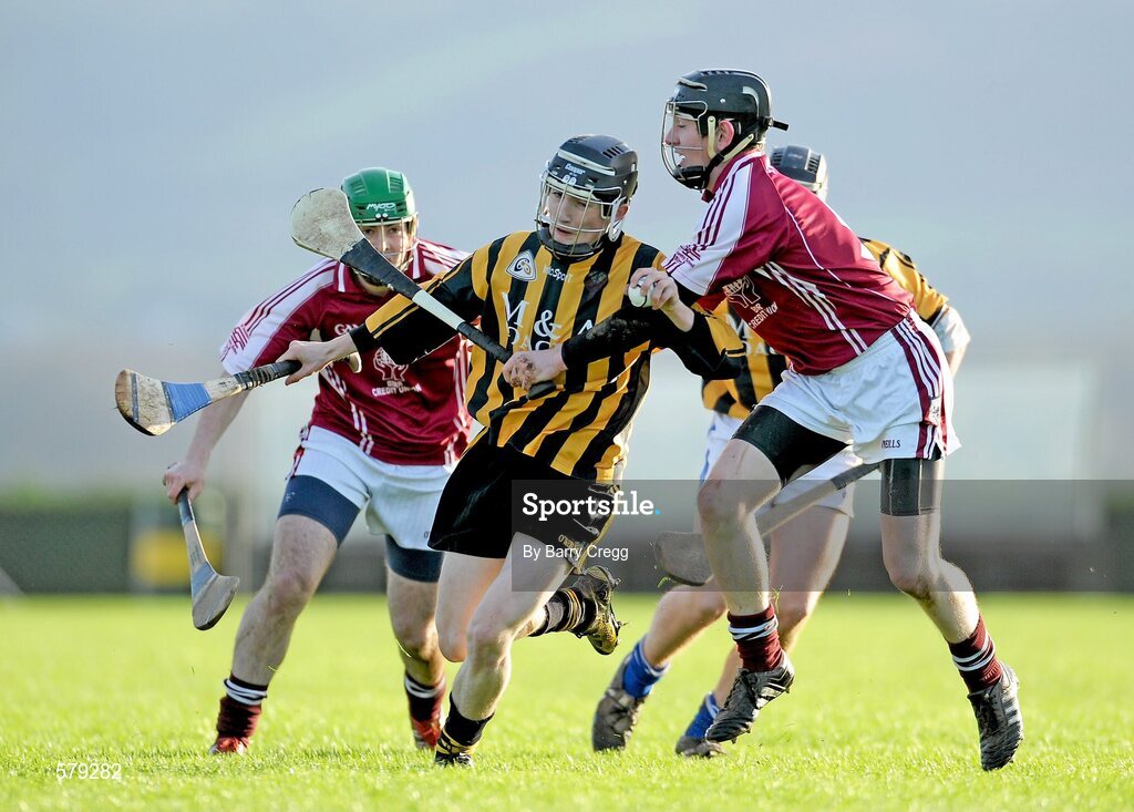 1 December 2011; Adrian Farrell, Castlecomer CS, is tackled by Conor Fitzgerald and Kevin Donovan, left, St. Brendan’s Birr. Leinster Colleges Senior Hurling “A” League Semi Final, St. Brendan’s Birr, Offaly, v Castlecomer CS, Kilkenny, Park Ratheniska GAA Grounds, Ratheniska, Co. Laois. Picture credit: Barry Cregg / SPORTSFILE