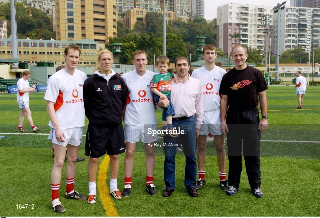 21 January 2005; Manager John Maughan, right, Mayo players, l to r, James Nallen, Ciaran McDonald, David Heaney and Ronan McGarrity with the Treasurer of the Hong Kong club Pat Foy, Murrisk, Wesport, Co Mayo, and his two and a half year old son Oliver after training in advance of the 2004 Vodafone All-Stars Exhibition Game, 2003 Vodafone All-Stars v 2004 Vodafone All-Stars, Hong Kong Football Club, Hong Kong, China. Picture credit; Ray McManus / SPORTSFILE