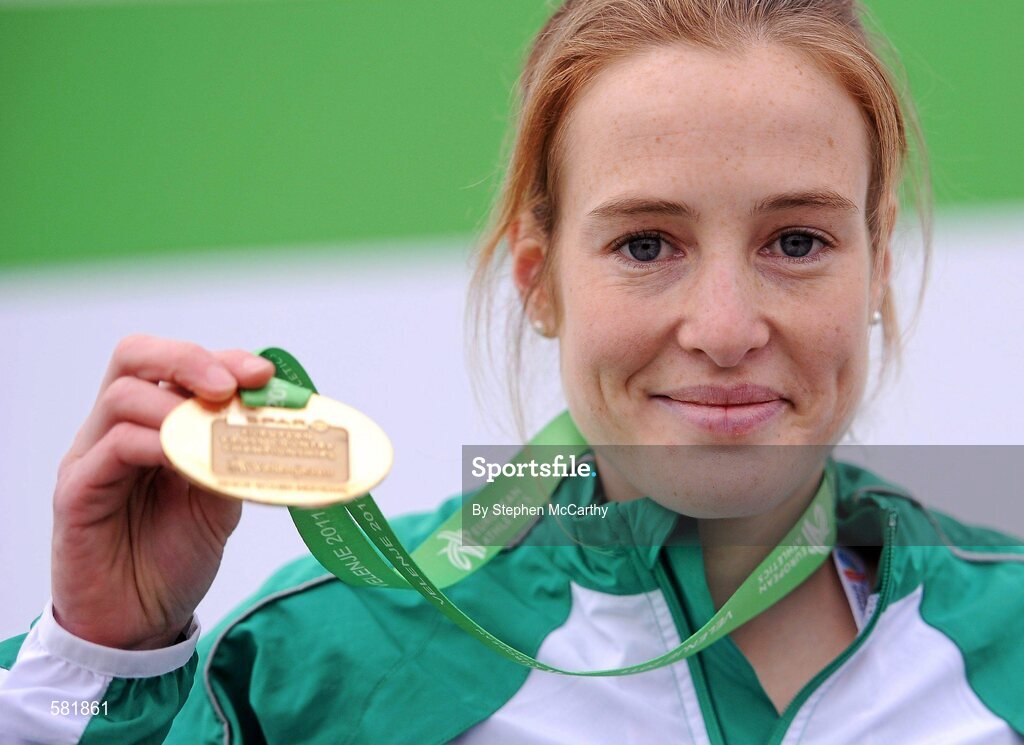 11 December 2011; Fionnuala Britton, Ireland, celebrates with her gold medal after winning the Senior Women's event at the 18th SPAR European Cross Country Championships 2011. Velenje, Slovenia. Picture credit: Stephen McCarthy / SPORTSFILE
