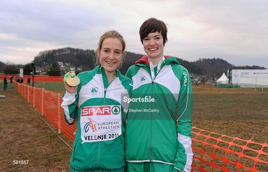 11 December 2011; Fionnuala Britton, Ireland, celebrates with her gold medal, with sister Una, who competed in the U23 Women's event, after winning the Senior Women's event at the 18th SPAR European Cross Country Championships 2011. Velenje, Slovenia. Picture credit: Stephen McCarthy / SPORTSFILE