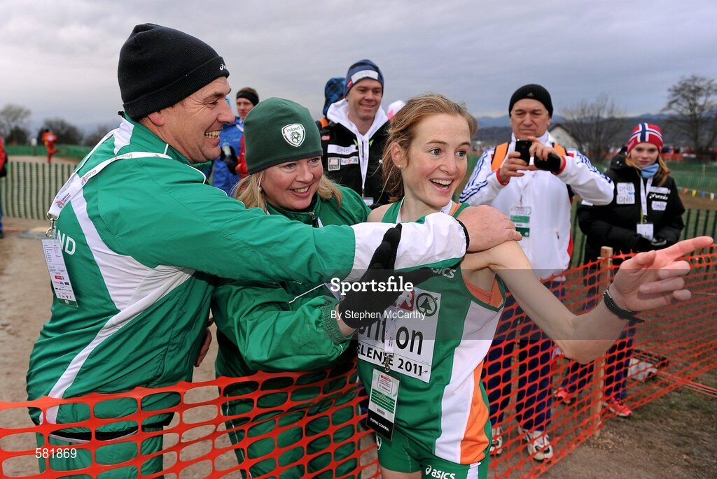 11 December 2011; Fionnuala Britton, Ireland, is congratulated by team coaches Neil Martin and Theresa McDaid after winning the Senior Women's event at the 18th SPAR European Cross Country Championships 2011. Velenje, Slovenia. Picture credit: Stephen McCarthy / SPORTSFILE