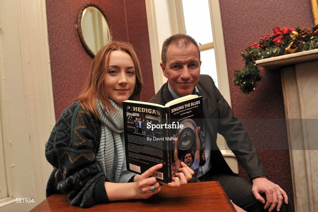 11 December 2011; Actress Saoirse Ronan, pictured with author Paul Huggard, at the launch of 'Singing the Blues'. Hedigan's Pub, Glasnevin, Dublin. Picture credit: David Maher / SPORTSFILE