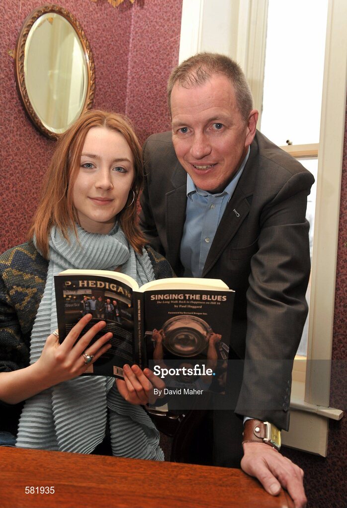 11 December 2011; Actress Saoirse Ronan, pictured with author Paul Huggard, at the launch of 'Singing the Blues'. Hedigan's Pub, Glasnevin, Dublin. Picture credit: David Maher / SPORTSFILE