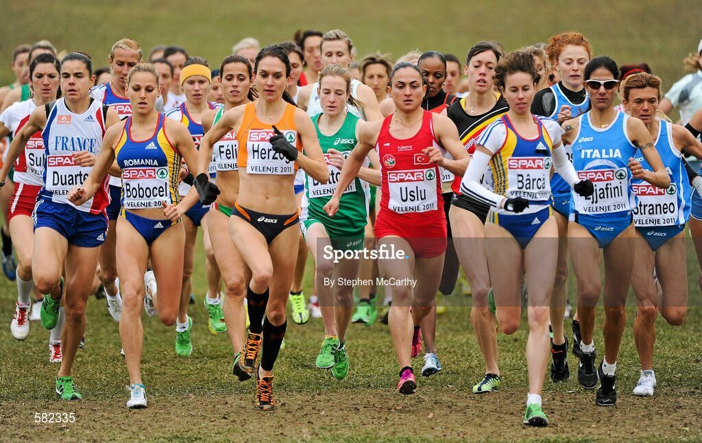 11 December 2011; Fionnuala Britton, Ireland, centre, on her way to victory in the Senior Women's event at the 18th SPAR European Cross Country Championships 2011. Velenje, Slovenia. Picture credit: Stephen McCarthy / SPORTSFILE