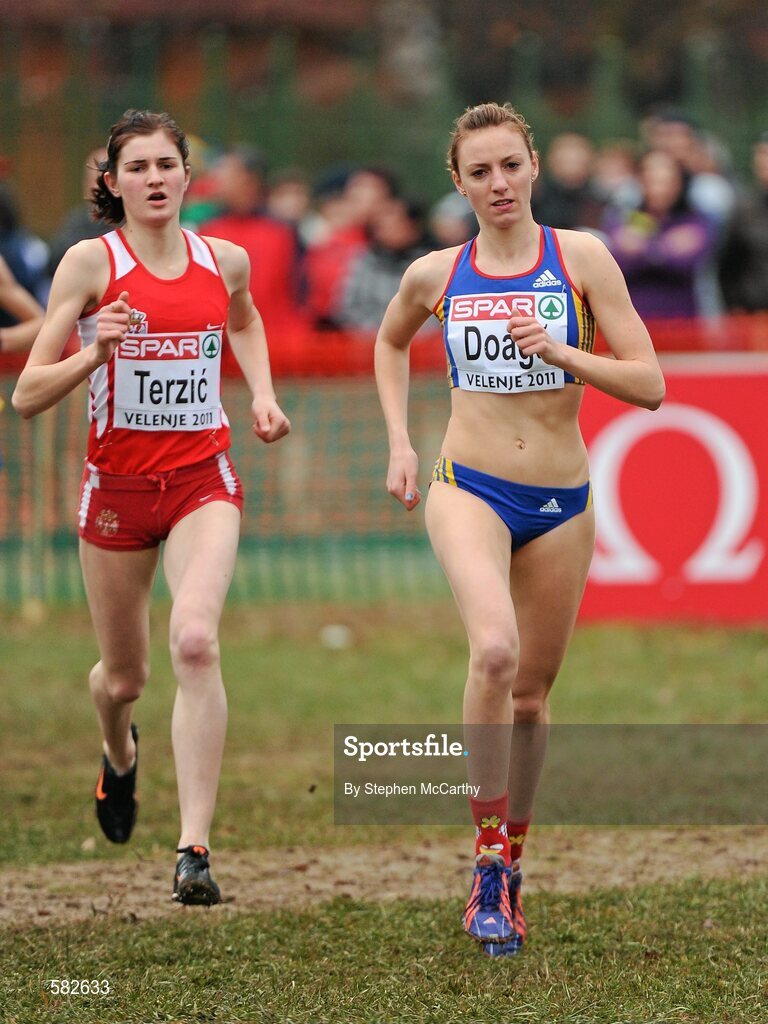 11 December 2011; Ioana Doaga, Romania, right, and Amela Terzic, Serbia, in action during the Junior Women's event at the 18th SPAR European Cross Country Championships 2011. Velenje, Slovenia. Picture credit: Stephen McCarthy / SPORTSFILE