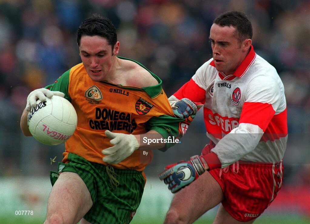 19 July 1998: Brendan Devenney, Donegal is tackled by Gary Coleman Derry. Ulster Football Final Derry v Donegal at St. Tighearnach's Park Clones. Picture Credit Matt Browne SPORTSFILE.