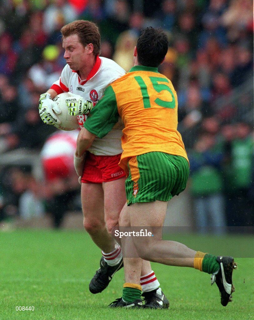 19 July 1998: Kieran McKeever, Derry Captain is tackled by Brendan Devenney Donegal. Ulster Football Final Derry v Donegal at St. Tighearnach's Park Clones. Picture Credit Matt Browne SPORTSFILE.