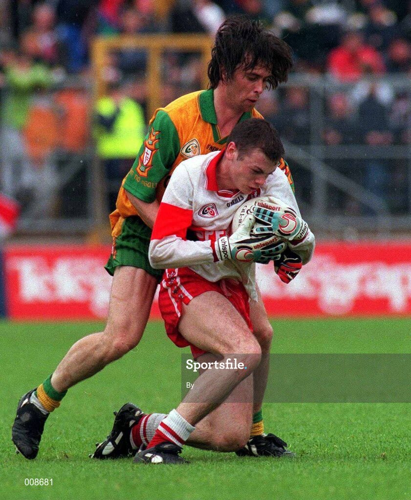 19 July 1998. Derry's Paul McFlynn is tackled by John Duffy, Donegal. Ulster Football Final, Derry v Donegal, Clones. Picture Credit Matt Browne/SPORTSFILE