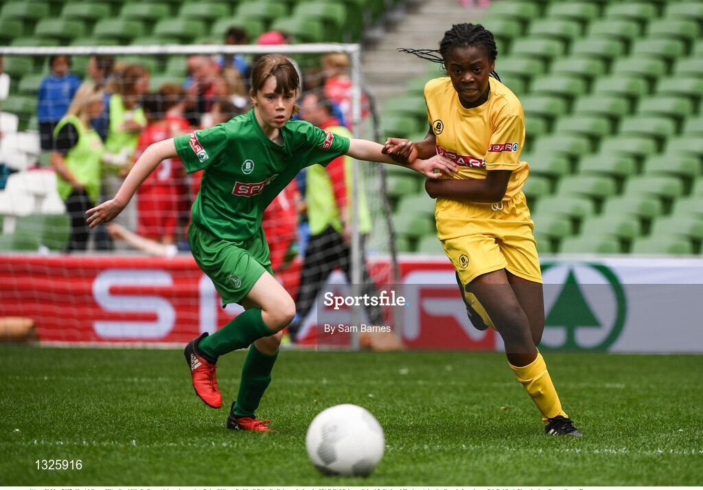 31 May 2017; Sineád Otoo of Woodland NS, Co Donegal, in action against Daisy O'Connell of Scoil Róis, Co Galway, during the SPAR FAI Primary School 5s National Finals at Aviva Stadium, in Lansdowne Rd, Dublin 4. Photo by Sam Barnes/Sportsfile