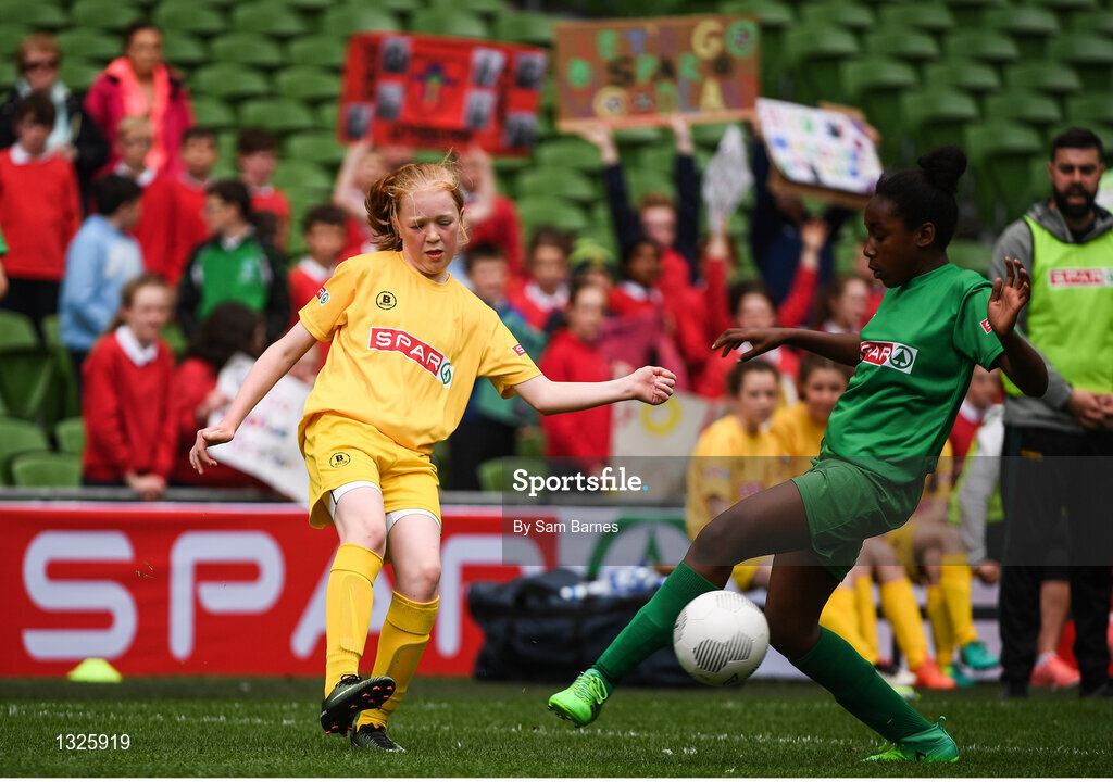 31 May 2017; Maria Kelly of Woodland NS, Co Donegal, in action against Eve Dossen of Scoil Róis, Co Galway, during the SPAR FAI Primary School 5s National Finals at Aviva Stadium, in Lansdowne Rd, Dublin 4. Photo by Sam Barnes/Sportsfile