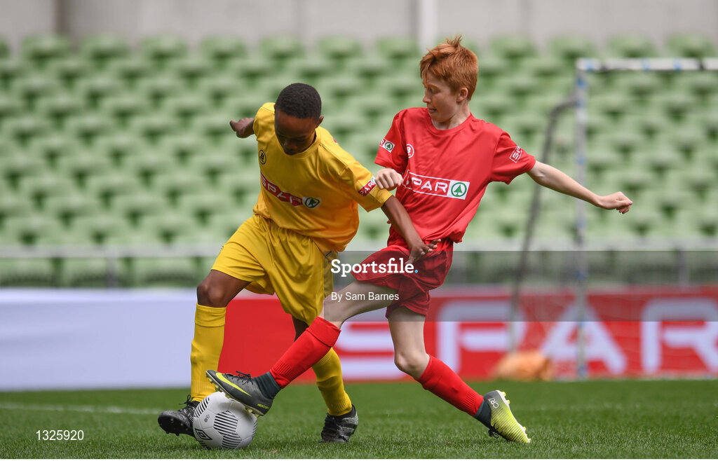 31 May 2017; Mark Mbuli of Dooish NS, Co Donegal, in action against John O'Sullivan of Scoil an Athar Tadhg, Co Cork, during the SPAR FAI Primary School 5s National Finals at Aviva Stadium, in Lansdowne Rd, Dublin 4. Photo by Sam Barnes/Sportsfile