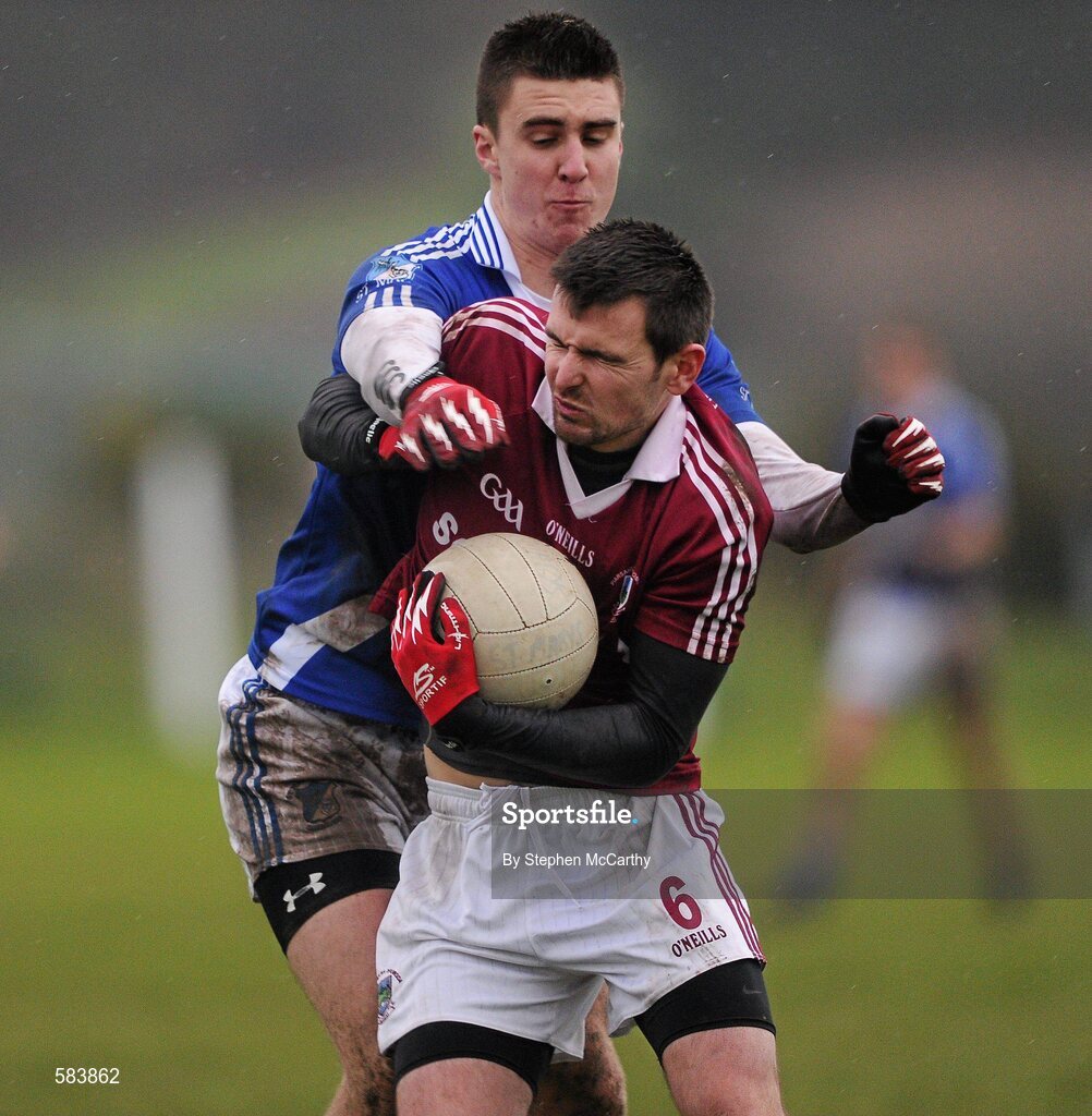 24 December 2011; Kevin O Sé, Dromid Pearses, in action against Daniel Daly, St. Mary's. South Kerry Senior Football Championship Final, St. Mary's v Dromid Pearses, Waterville Sportsfield, Waterville, Co. Kerry. Picture credit: Stephen McCarthy / SPORTSFILE