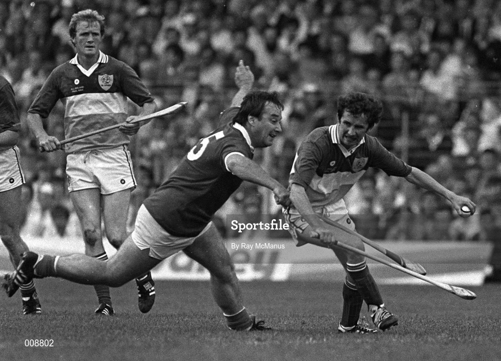 2 September 1984; Ger Coughlan of Offaly in action against Seán O'Leary of Cork during the All-Ireland Senior Hurling Championship Final match between Cork and Offaly at Semple Stadium in Thurles, Tipperary. Photo by Ray McManus/Sporsfile