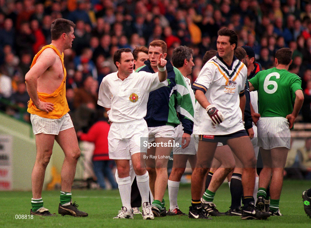 11 October 1998; Referee Andrew Coates sends off Ireland goalkeeper Finbar McConnell after players from both sides were involved in a tussle at the end of the third quarter during the International Rules Series First Test match between Ireland and Australia at Croke Park in Dublin. Photo by Ray Lohan/Sportsfile