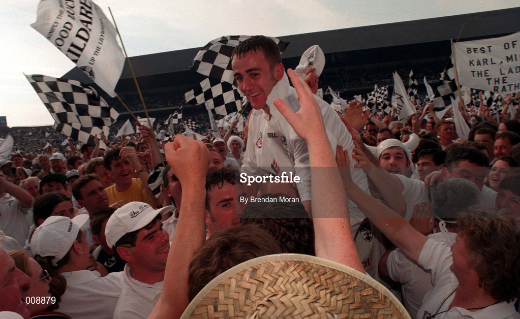 30 August 1998; Kildare's Brian Lacey is shouldered off the pitch after the Bank of Ireland All-Ireland Senior Football Championship Semi-Final match between Kerry and Kildare at Croke Park in Dublin. Photo by Brendan Moran/Sportsfile
