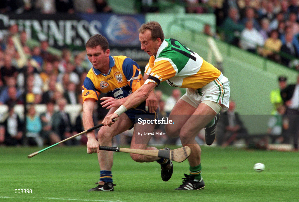 22 August 1998; Brian Quinn of Clare in action against Joe Dooley of Offaly during the Guinness All-Ireland Hurling All-Ireland Senior Championship Semi-Final Replay match between Clare and Offaly at Croke Park in Dublin. Photo by David Maher/Sportsfile