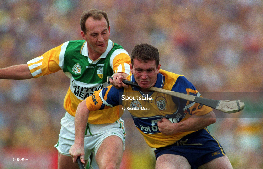 29 August 1998; Brian Quinn of Clare is tackled by Joe Dooley of Offaly during the Guinness All-Ireland Senior Hurling Championship Semi-Final Refixture match between Clare and Offaly at Semple Stadium in Thurles, Tipperary. Photo by Brendan Moran/Sportsfile