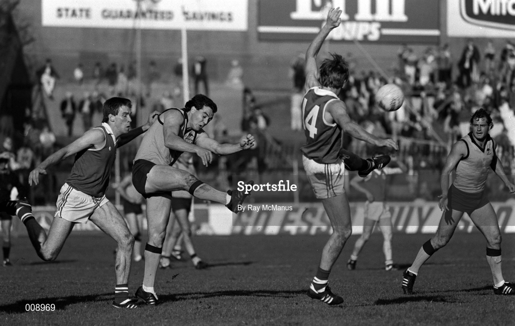 18 October 1987; Bruce Lindner of Australia, shoots for a score as Tom Spillane, left, and Ger Lynch of Ireland close in during the International Rules Series First Test match between Ireland and Australia at Croke Park in Dublin. Photo by Ray McManus/Sportsfile