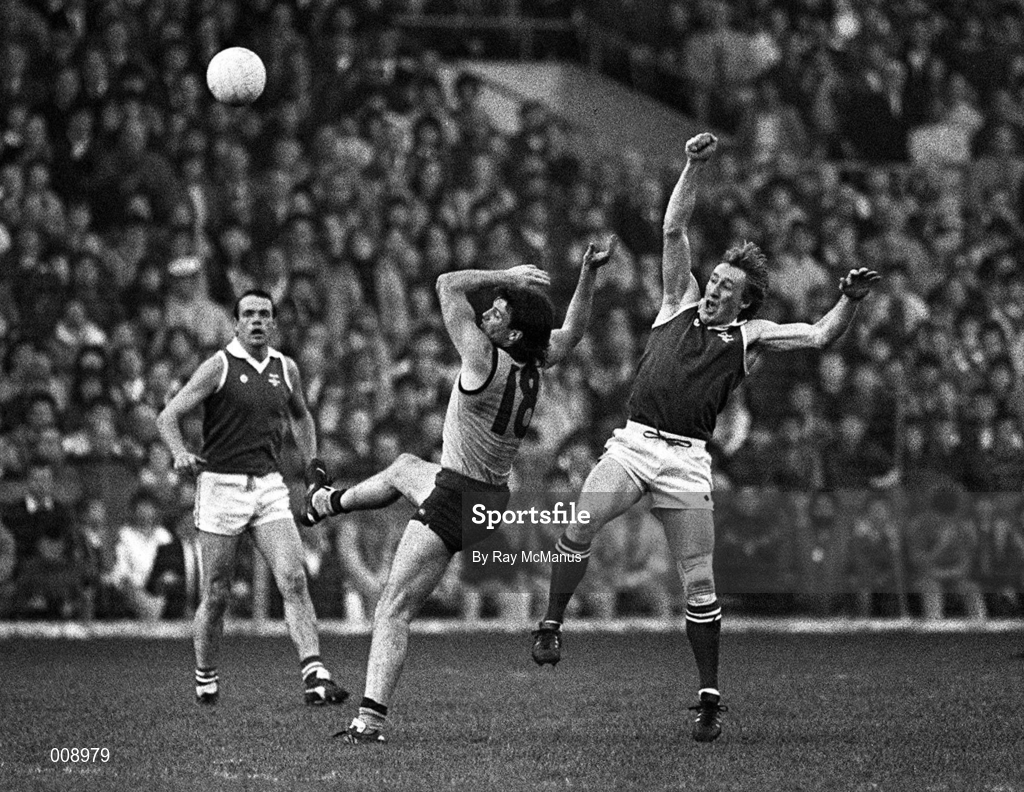 1 November 1987; Paul Roos of Australia, contests an aerial ball with Pat Spillane of Ireland, supported by team-mate Mick Lyons, left, during the International Rules Series Third Test match between Ireland and Australia at Croke Park in Dublin. Photo by Ray McManus/Sportsfile