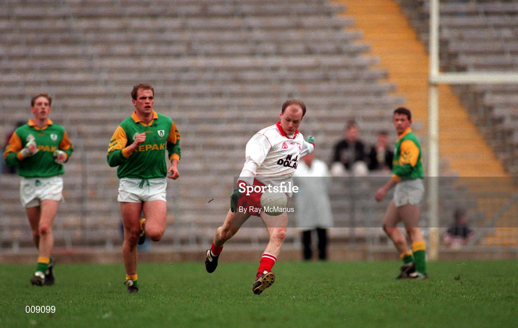 23 March 1997; Peter Canavan of Tyrone on the attack as Meath players Trevor Giles, left, and John McDermott look on during the Church & General National Football League match between Tyrone and Meath at St Tiernach's Park in Clones, Monaghan. Photo by Ray McManus/Sportsfile