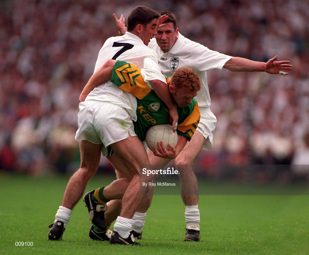 2 August 1998; Enda McManus of Meath in action against Anthony Rainbow and Niall Buckley, behind, of Kildare during the Bank of Ireland Leinster Senior Football Championship Final match between Kildare and Meath at Croke Park in Dublin. Photo by Ray McManus/Sportsfile