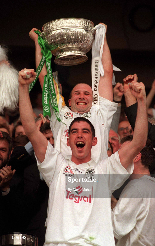 2 August 1998; Kildare captain Glenn Ryan lifts the cup, as team-mate Anthony Rainbow celebrates, after the Bank of Ireland Leinster Senior Football Championship Final match between Kildare and Meath at Croke Park in Dublin. Photo by David Maher/Sportsfile