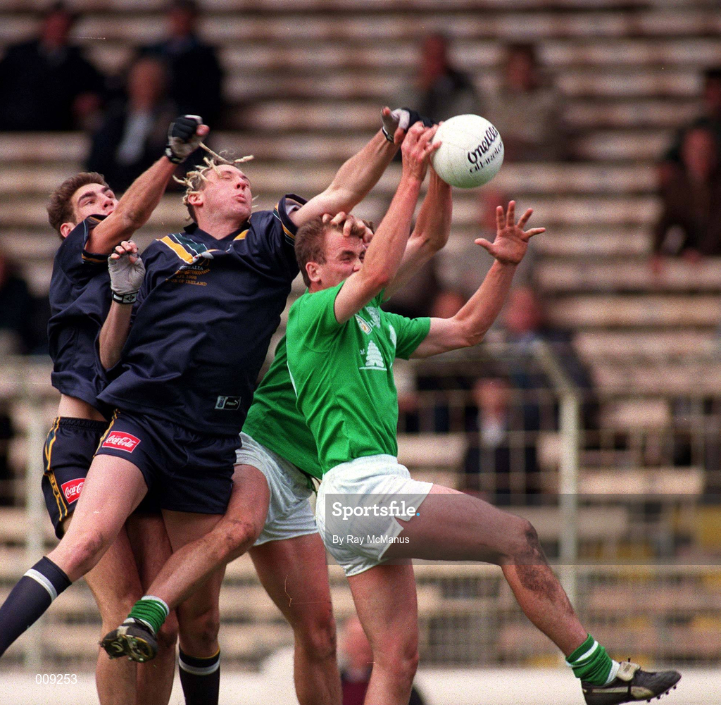 11 October 1998; John McDermott and Darren Fay, behind, of Ireland, in action against Nick Holland and Peter Everitt of Australia during the International Rules Series First Test match between Ireland and Australia at Croke Park in Dublin. Photo by Ray McManus/Sportsfile