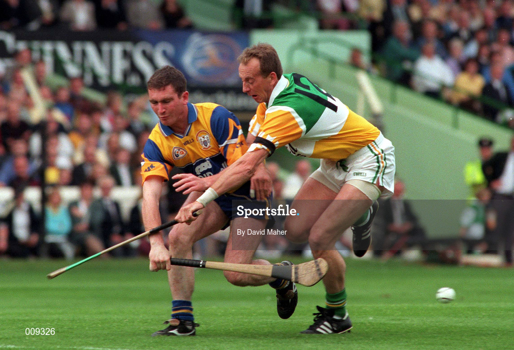22 August 1998; Brian Quinn of Clare in action against Joe Dooley of Offaly during the Guinness All-Ireland Hurling All-Ireland Senior Championship Semi-Final Replay match between Clare and Offaly at Croke Park in Dublin. Photo by David Maher/Sportsfile