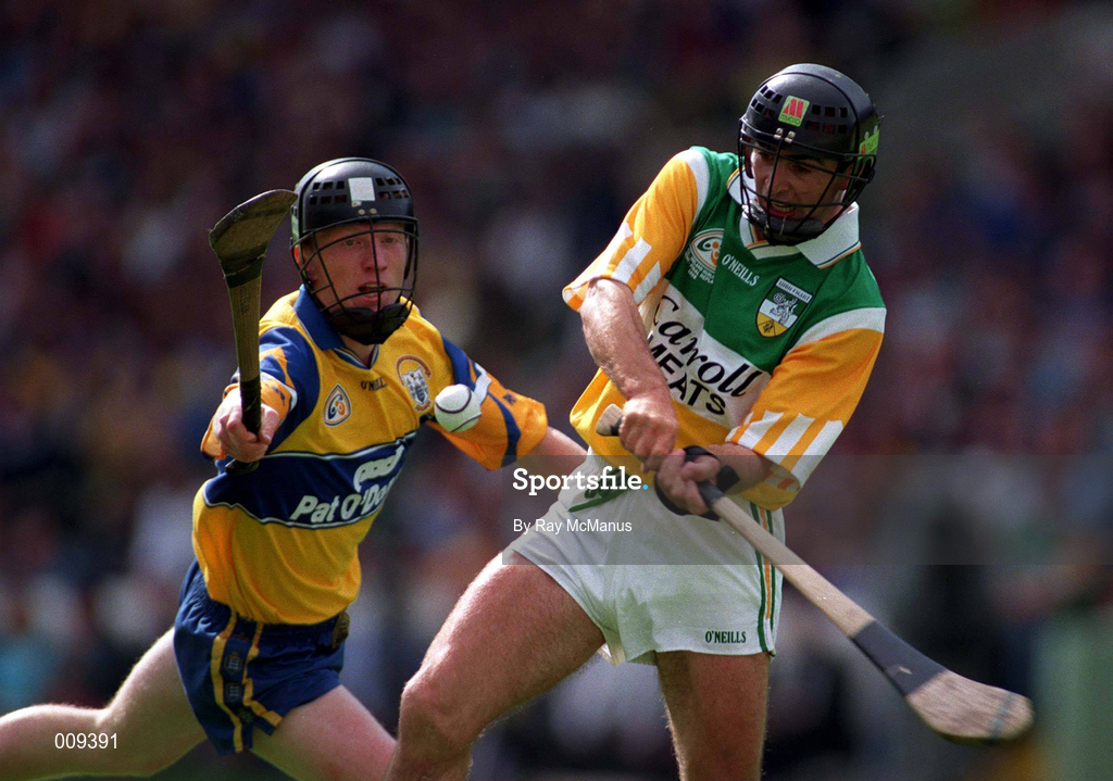 22 August 1998; Johnny Dooley of Offaly in action against Niall Gilligan of Clare during the Guinness All-Ireland Hurling All-Ireland Senior Championship Semi-Final Replay match between Clare and Offaly at Croke Park in Dublin. Photo by Ray McManus/Sportsfile